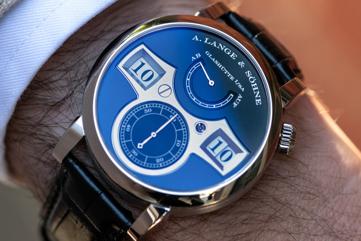 A close-up lifestyle shot of a wrist wearing an A. Lange & Söhne Zeitwerk watch.
